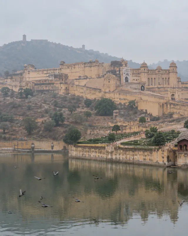 Amer Fort above Maota Lake in Jaipur, Rajasthan, on a hazy morning