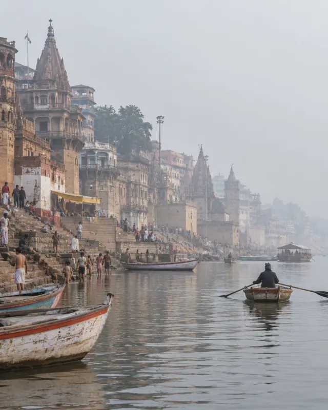 Boats and stone ghats on the Ganga at Varanasi, Uttar Pradesh, in morning mist